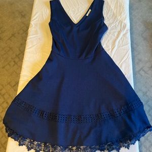 Bright blue semi formal dress. V neck and back and lace trim on skirt.